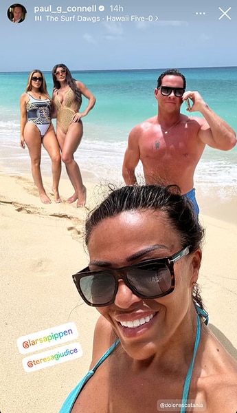 Dolores Catania and Paul Connell on the beach with Larsa Pippen and Teresa Giudice in the background.