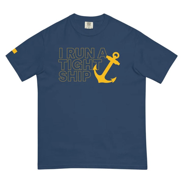 A blue tee shirt that reads "I run a tight ship"