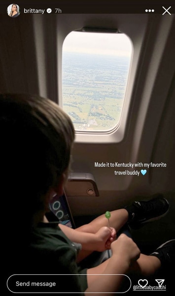 Cruz Cauchi sitting in plane looking out the window as the plane lands.