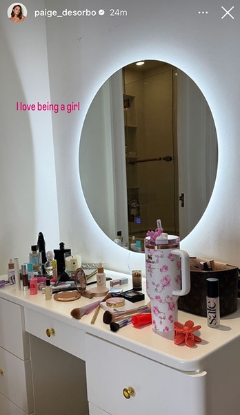 Paige DeSorbo's vanity with makeup and brushes on it.