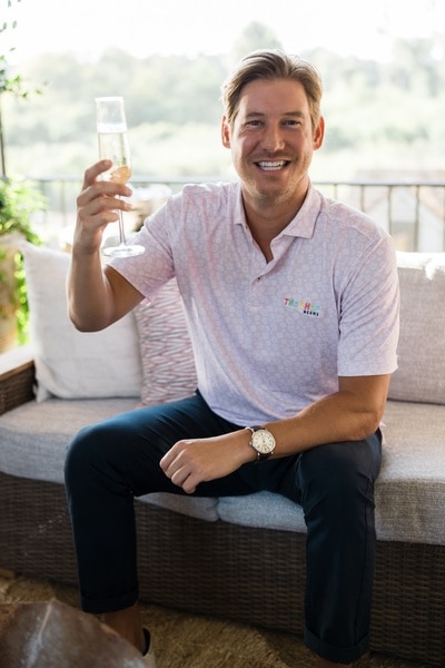 Austen Kroll of Southern Charm raises a glass.