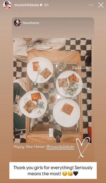 Plates of food on a table in Katie Maloney's new home.