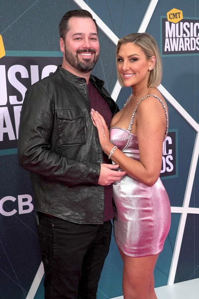 Travis Mullen and Gina Kirschenheiter on the 2022 CMT Music Awards red carpet