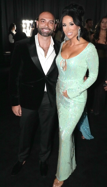 John Fuda poses with Rachel Fuda in a green dress at the video music awards