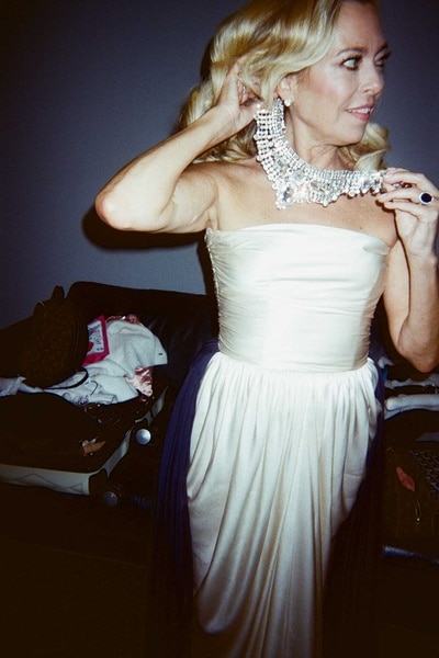 Sutton Stracke adjusts her necklace backstage at The Real Housewives of Beverly Hills Season 14 press shoot