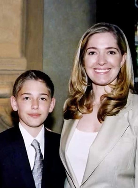 Erika Jayne and her son Thomas as a boy wearing formal clothes