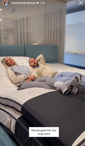 Josh Altman and Heather Altman laying on a bed mattress together