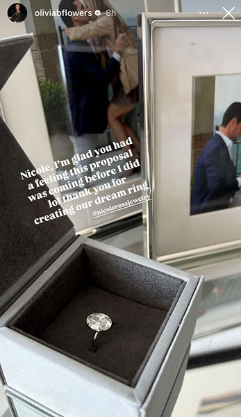 A close up of Olivia Flowers' engagement ring in a box.