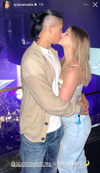 Ariana Madix and Daniel Wai kissing at a Kacey Musgraves concert.