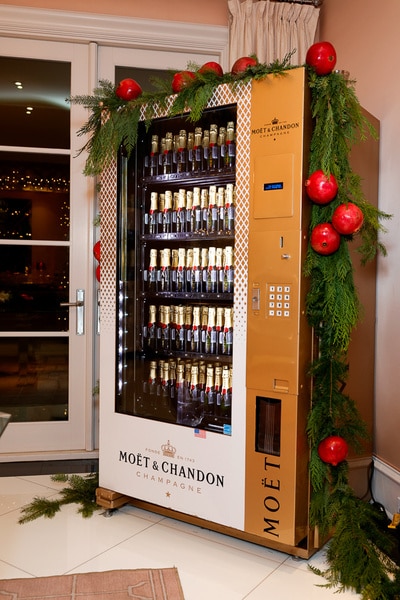 A Moet Chandon vending machine covered in christmas decorations at Kathy Hilton's home