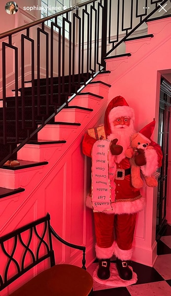 Kyle Richards' home entryway with a large santa decoration.