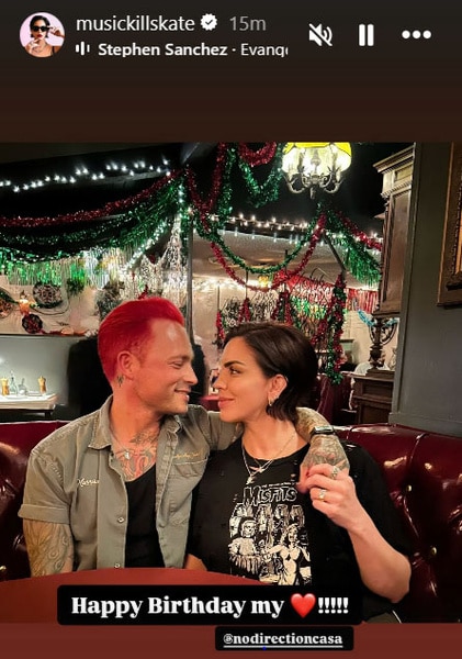 Katie Maloney and Nick Martin embracing in a dining booth.