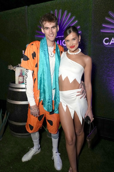 Presley Gerber and Lexi Wood attend the Casamigos Halloween Party as Fred and Wilma Flinstone and