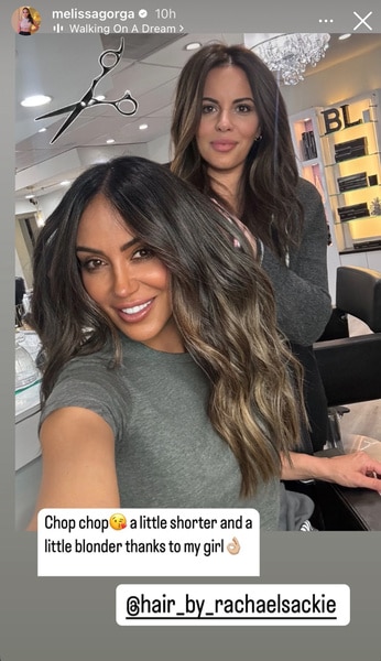 Melissa Gorga sitting at a hair salon with her hair stylist