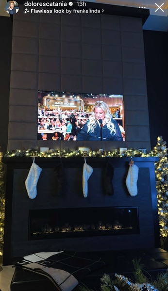 Dolores Catania's tv with christmas decor surrounding it