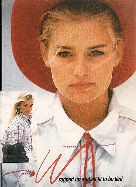 Yolanda Foster in a magazine ad wearing a white collared shirt and red hat