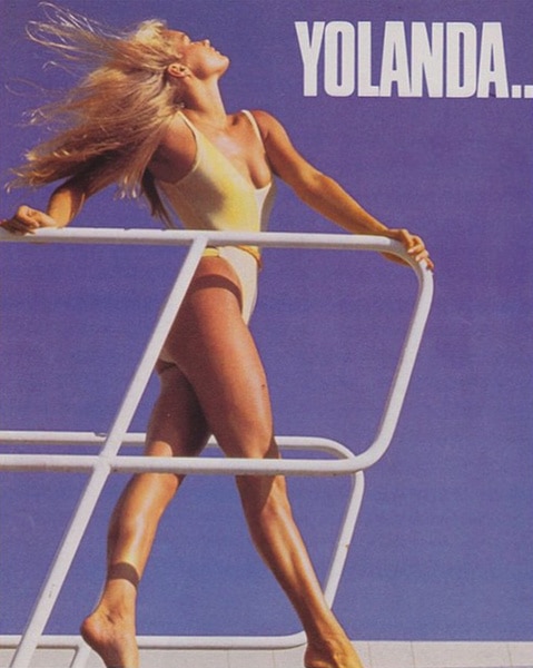 Yolanda Hadid on a boat wearing a yellow bathing suit