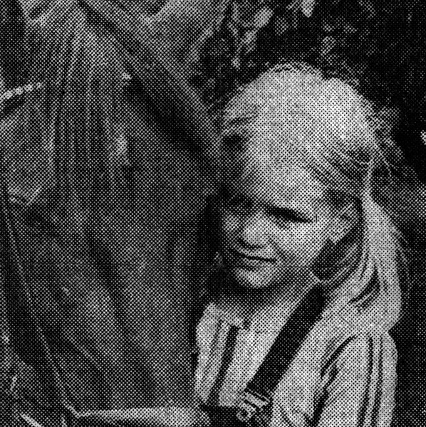 Yolanda Hadid as a young girl wearing pigtails with her horse.