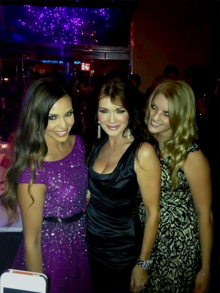 Scheana Shay, Lisa Vanderpump, and Pandora Vanderpump Sabo posing together and smiling.