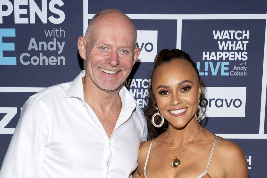 Ashley Darby and Michael Darby in front of the WWHL step and repeat.