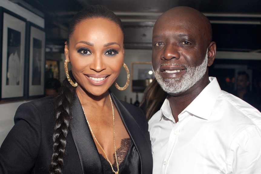 Cynthia Bailey and Peter Thomas smiling next to each other.