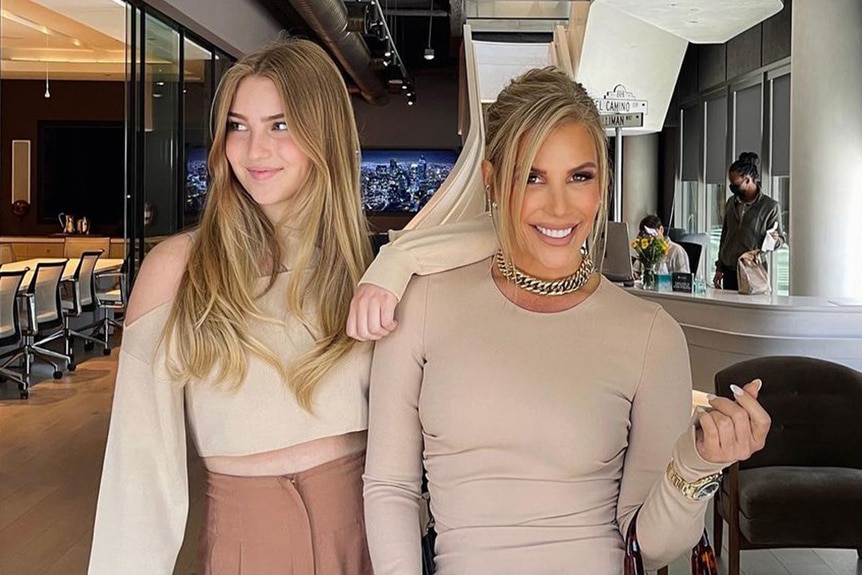 Tracy Tutor and her daughter Juliet wearing beige outfits together.