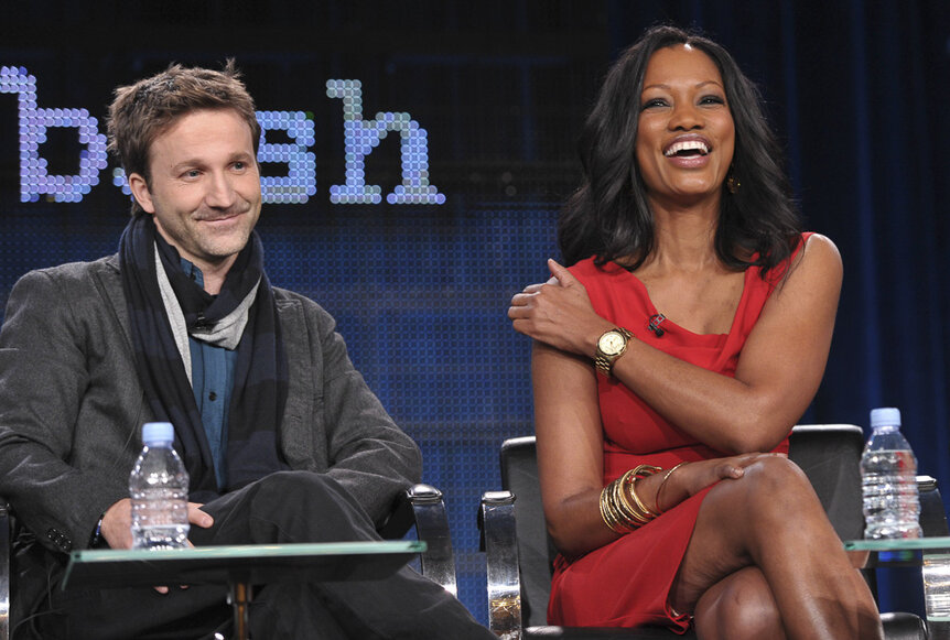 Breckin and Garcelle sitting together and laughing.