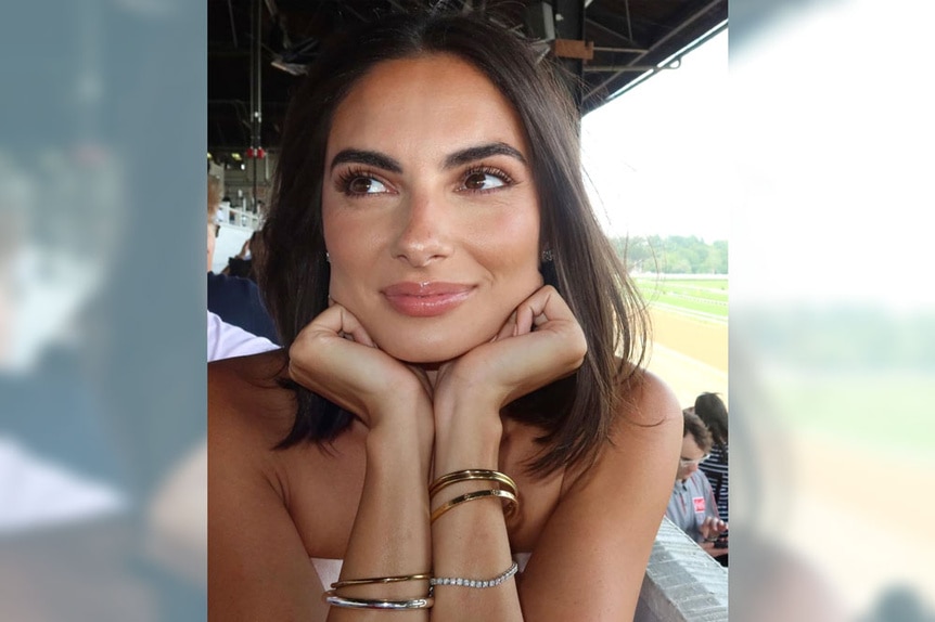 Paige DeSorbo smiles while out at a race track.