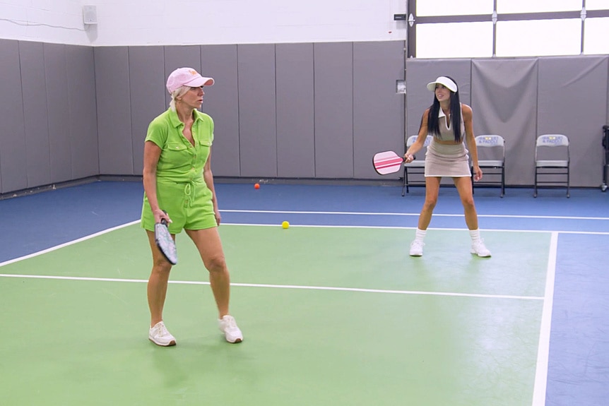 Margaret Josephs and Rachel Fuda playing pickleball together on a court.