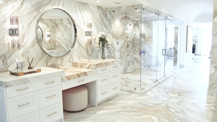 A bathroom in Josh Altman's listing featuring a vanity and large double shower.