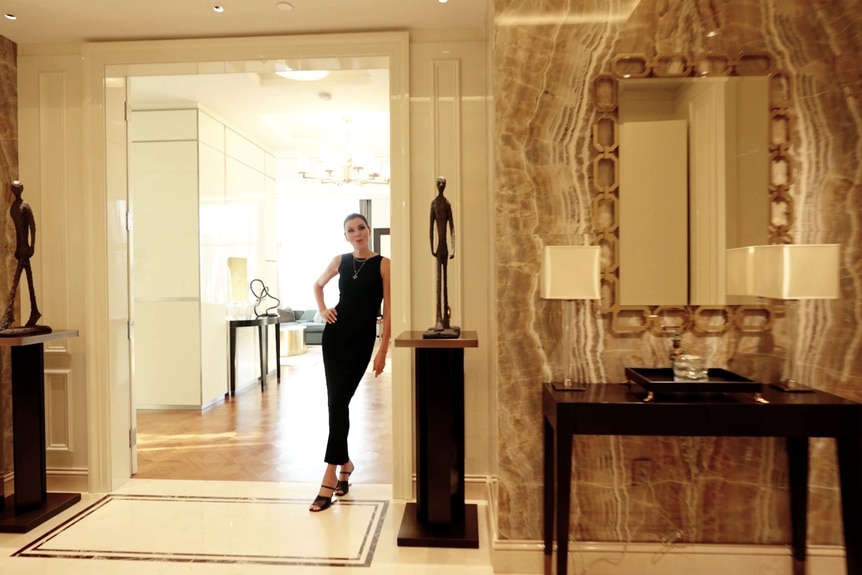 Heather Dubrow standing in her foyer.