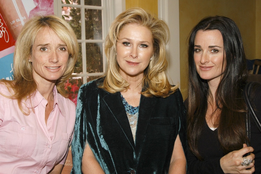 Kyle Richards, Kathy Hilton, and Kim Richards smiling next to each other.