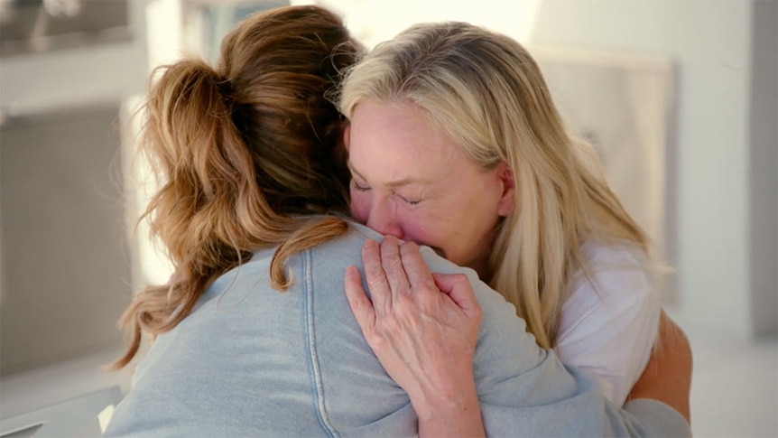 Shannon Beador crying while hugging Emily Simpson.