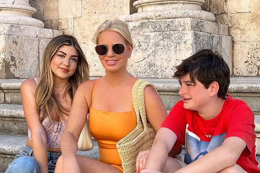 Caroline Stanbury and Yasmine Habib sitting together while on vacation.