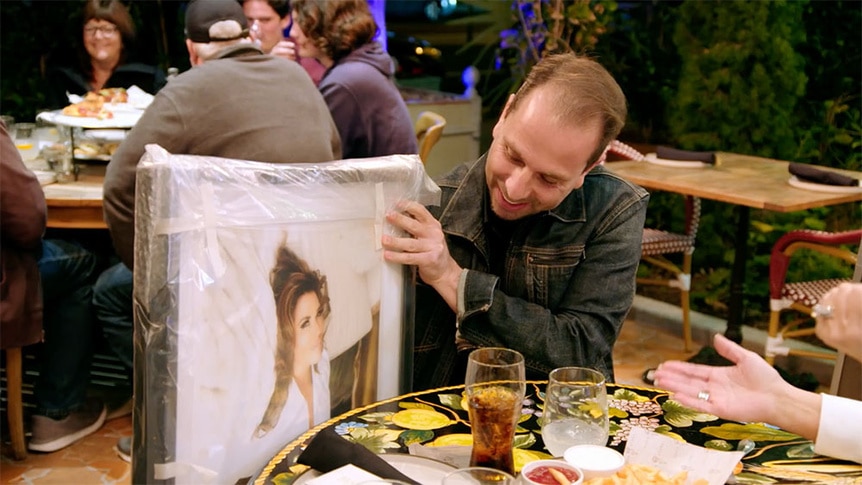 Emily Simpson gifts Shane Simpson a frame photo of herself.