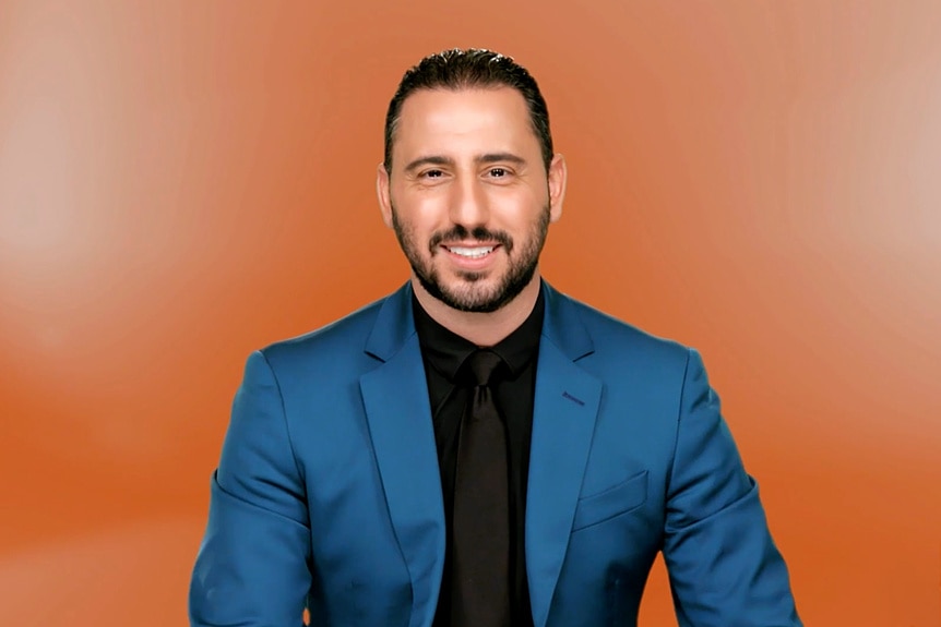 Josh Altman wearing a blue suit during one of his MDLLA interviews