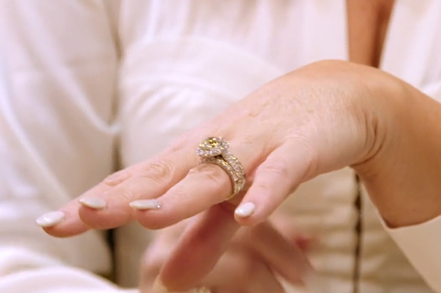 Detail shot of Emily Simpson's engagement ring