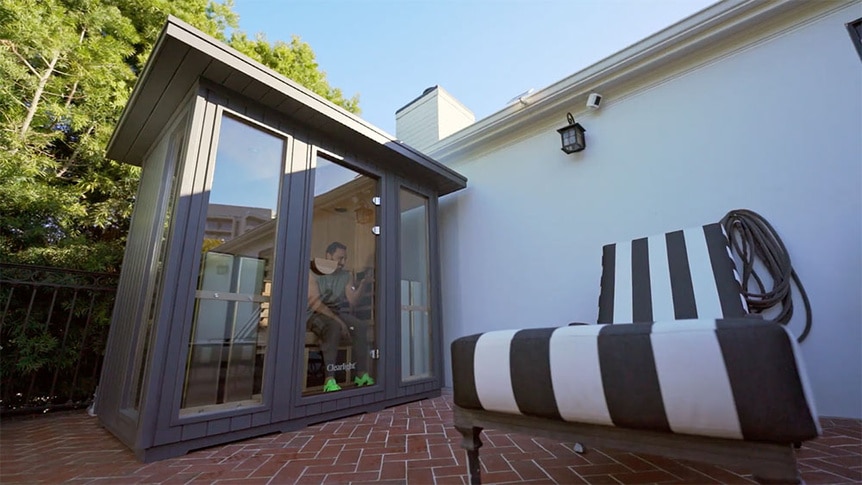 Josh Altman sitting in his backyard sauna.