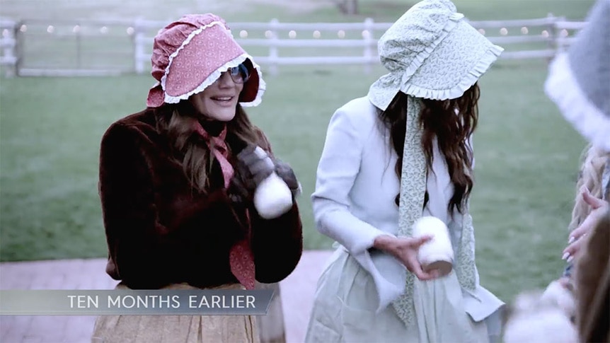 Meredith Marks smiling while churning butter.