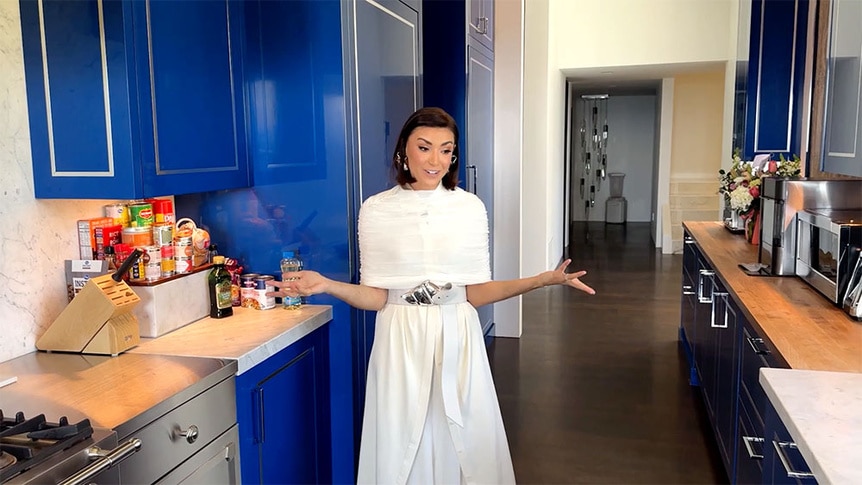 Bronwyn Newport standing in her kitchen talking.