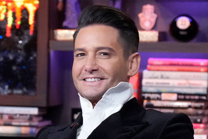 Josh Flagg smiling at the Watch What Happens Live clubhouse in New York City.