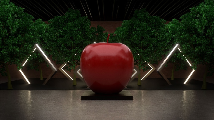 A giant apple in the middle of a room with trees surrounding it.