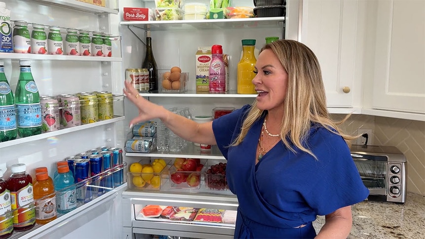 Heather Gay standing and talking in front of her fridge.