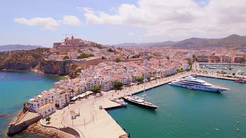 An aerial view of the Parsifal 3 sailing yacht in an Ibiza marina.