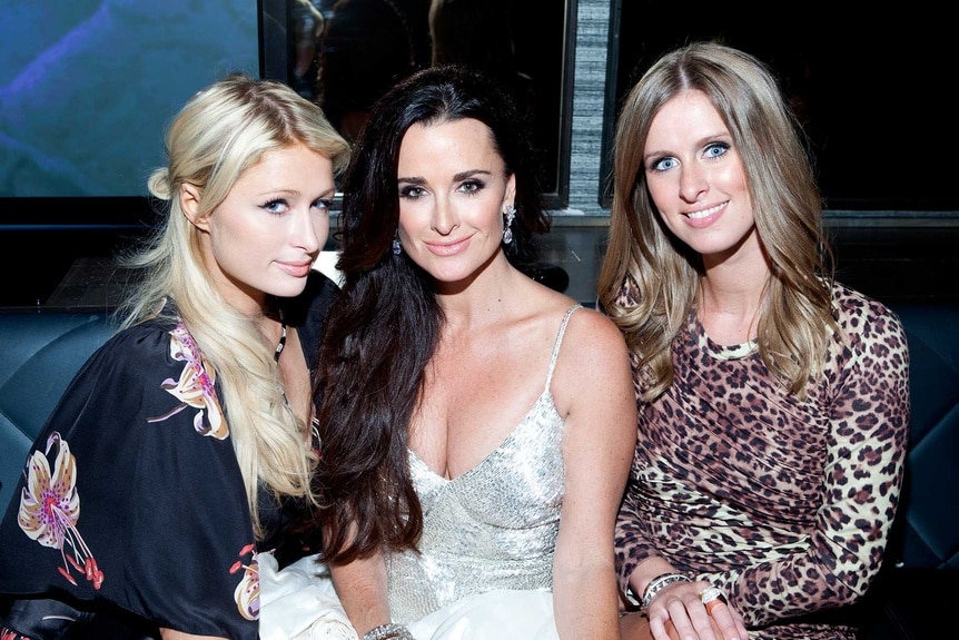 Paris Hilton, Kyle Richards and Nicky Hilton sitting together during the premiere of RHOBH Season 1