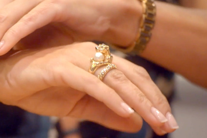 The Cartier Panthere ring on Sutton Stracke's finger