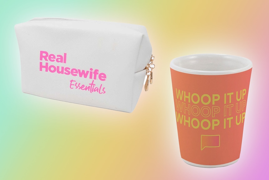 A zippered pouch and a coffee cup in front of a pastel color background