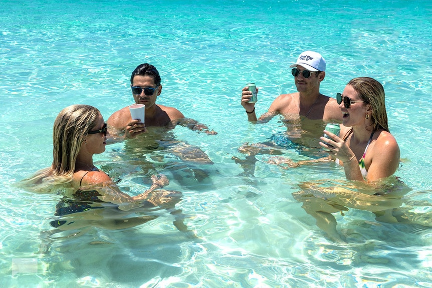 Madison Lecroy, Rodrigo Reyes, Austen Kroll and Molly O’Connell in the ocean together