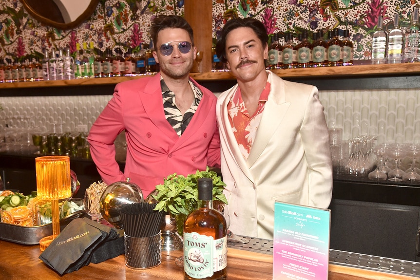 Tom Schwartz and Tom Sandoval standing at Schwartz & Sandy's bar