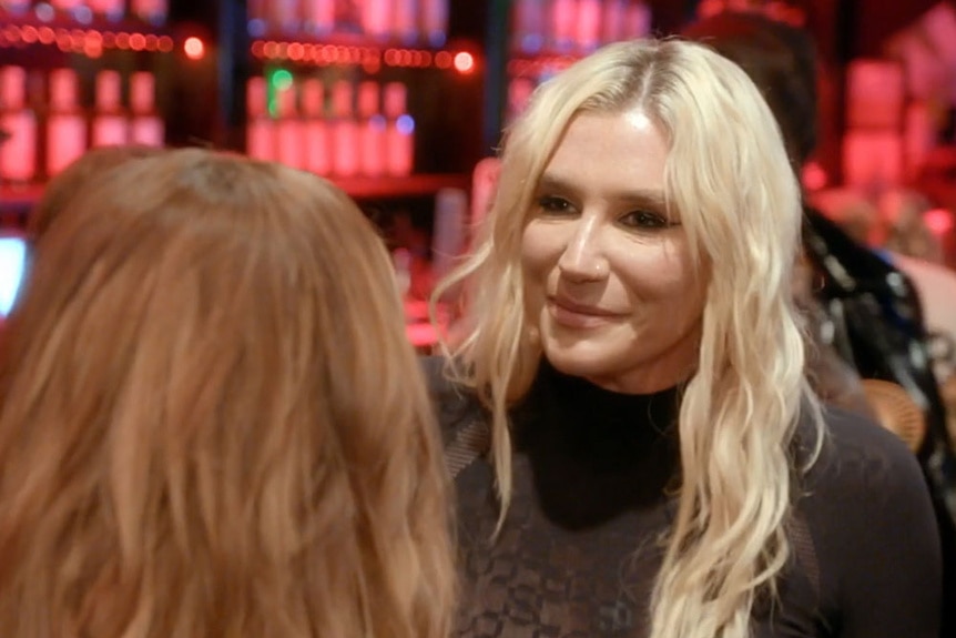 Musician Kesha talking to Dorit Kemsley during a night out